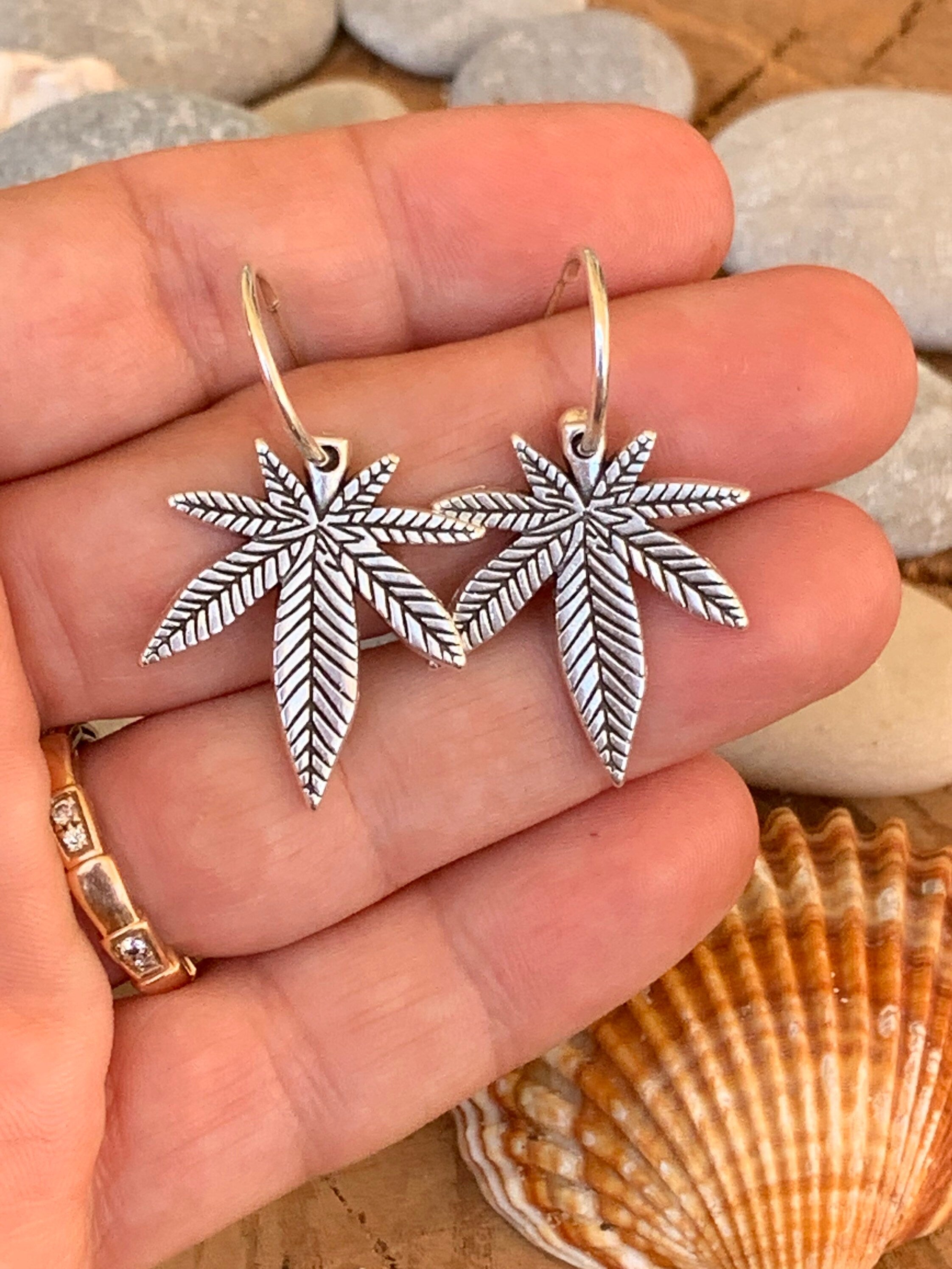 Bohemian silver earrings with dangle marijuana leaf
