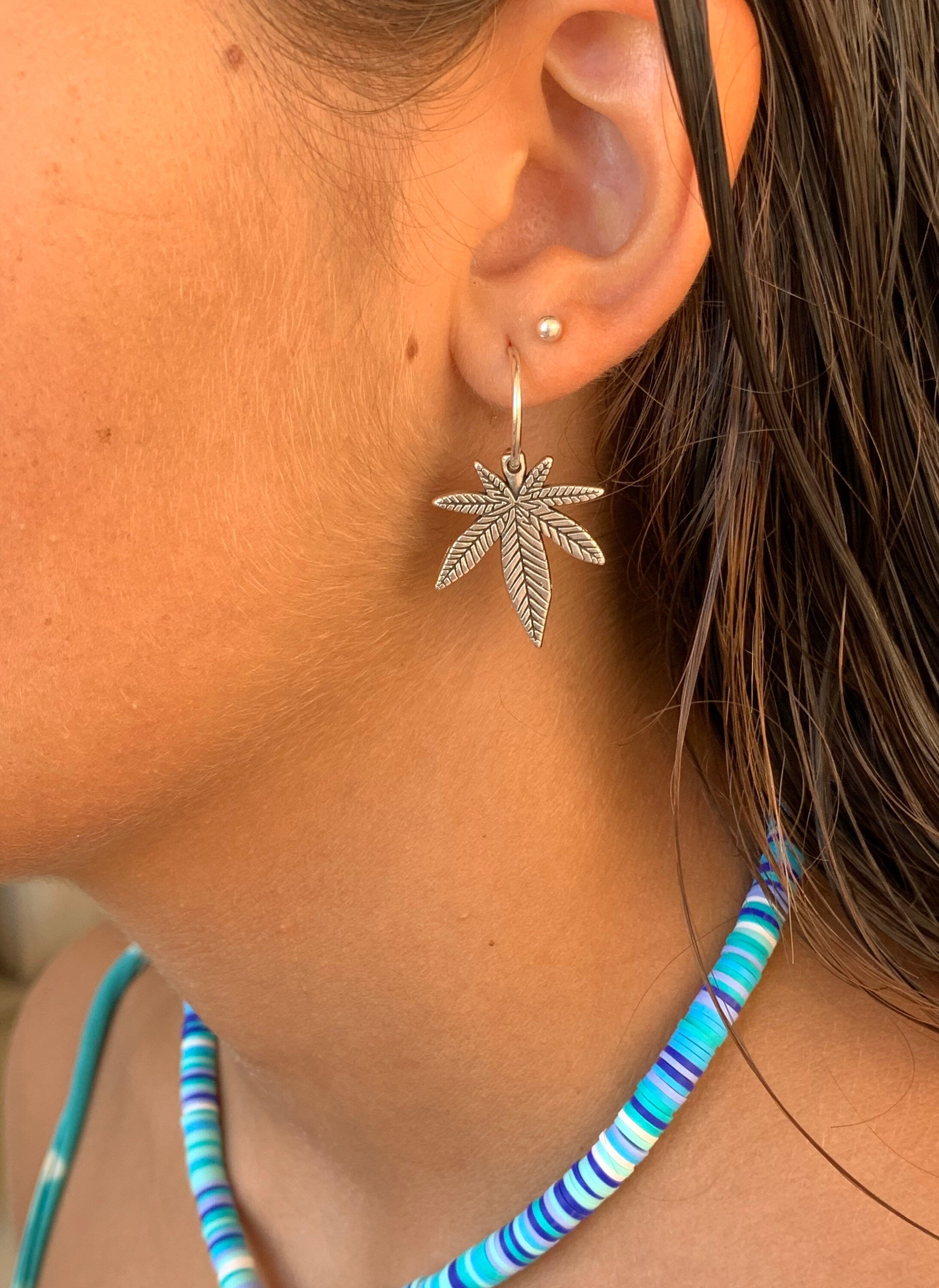 Bohemian silver earrings with dangle marijuana leaf