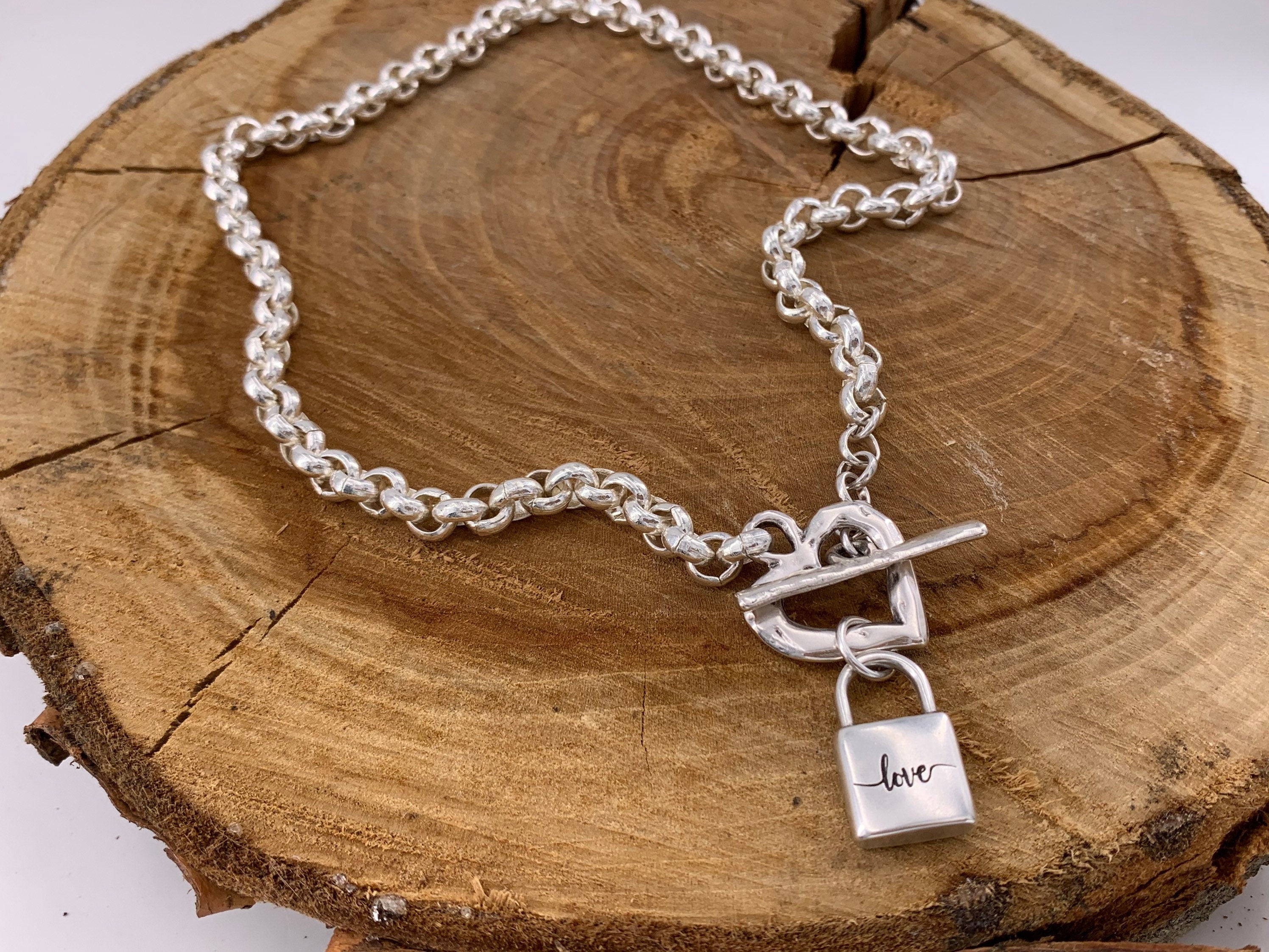 Thick chain silver necklace with a heart-shaped toggle clasp and a padlock-shaped pendant, uno de 50 style silver chunky necklace,