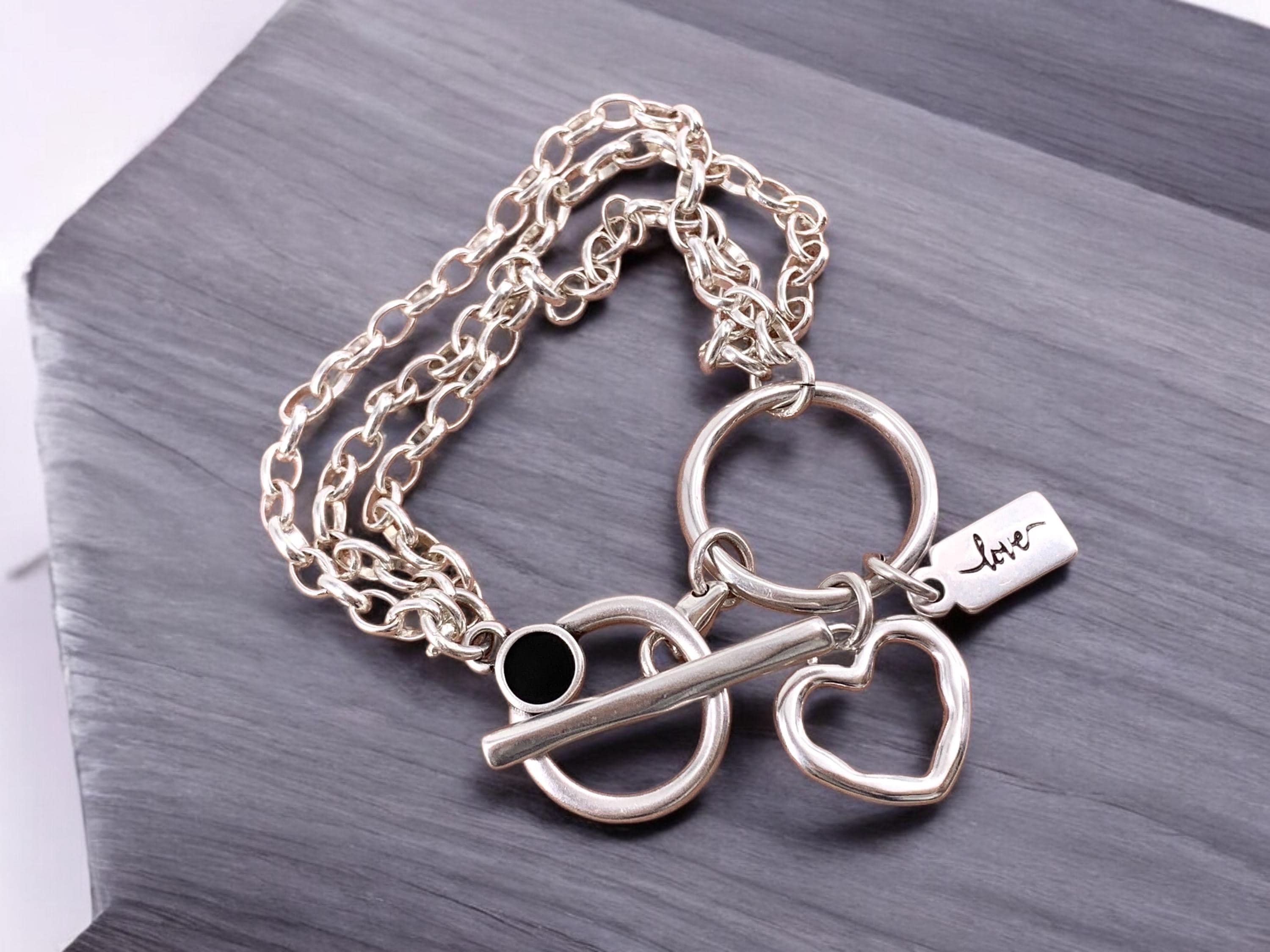 Multi strand silver chain bracelet with toggle clasp and heart charm