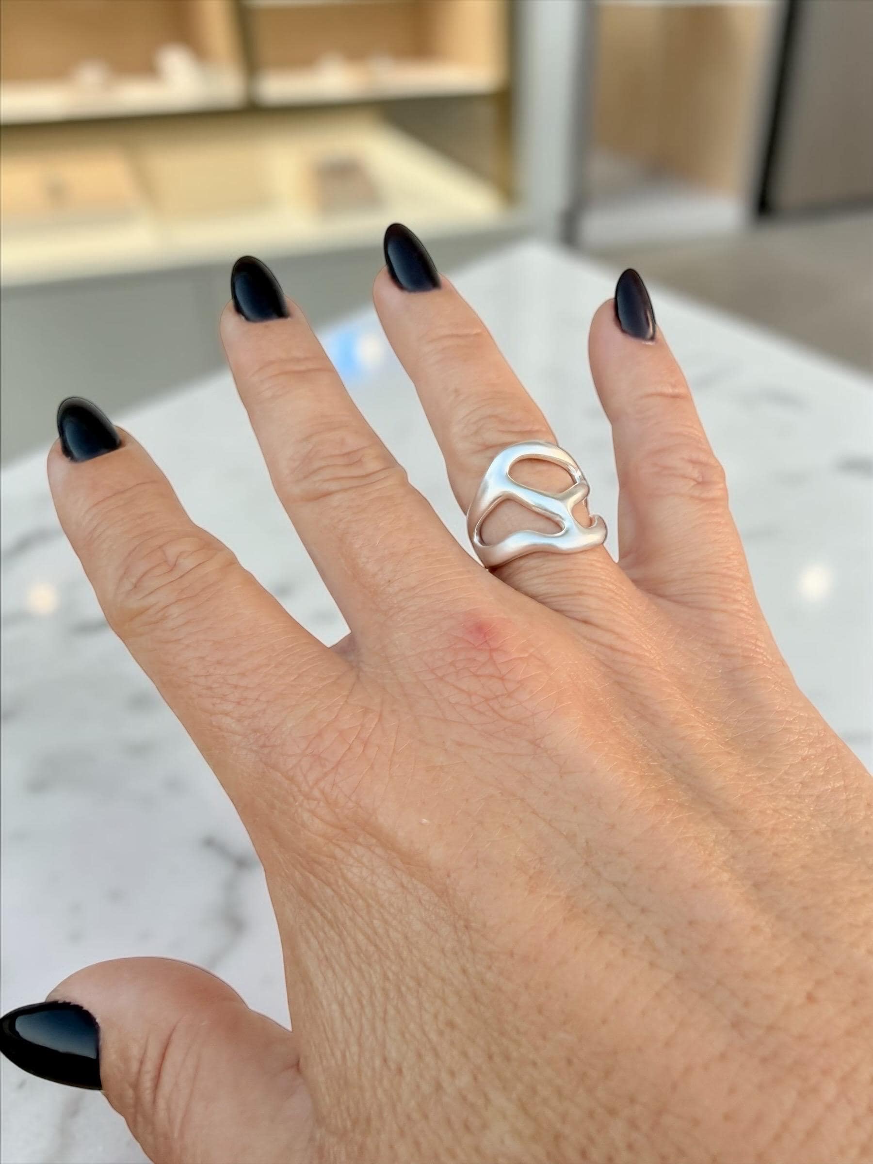 Artisian silver plated carved ring with open band design and bohemian style