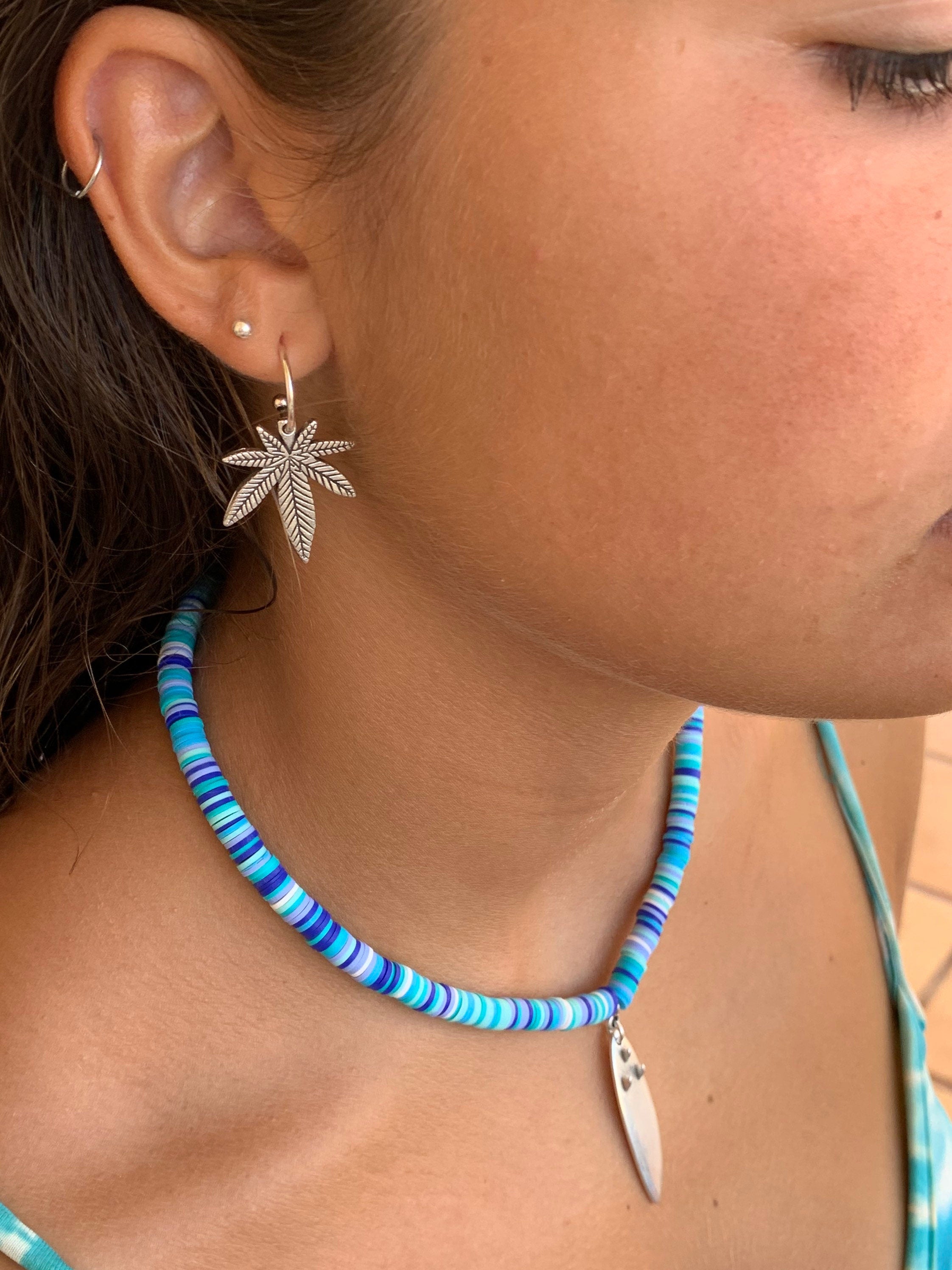 Bohemian silver earrings with dangle marijuana leaf