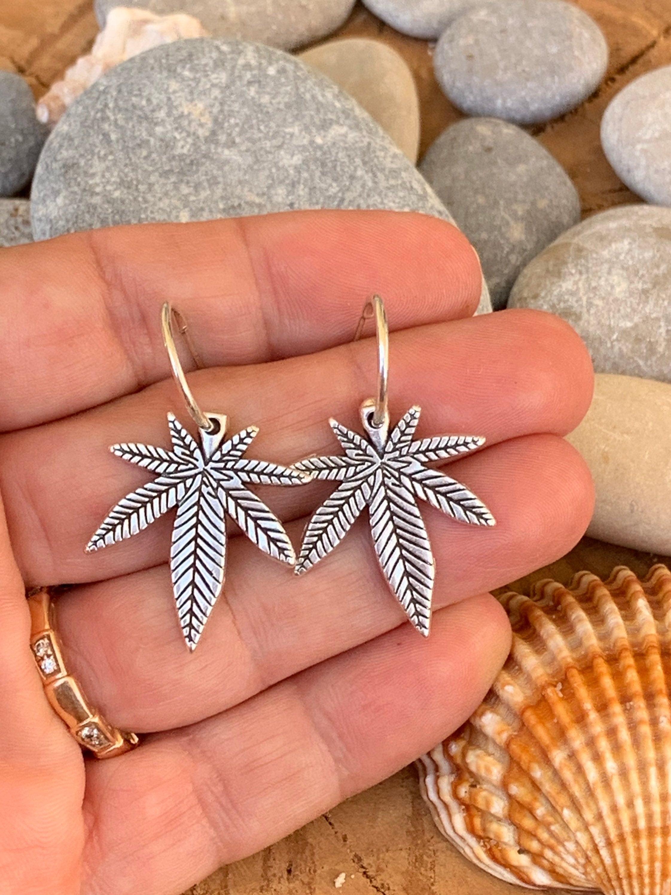 Bohemian silver earrings with dangle marijuana leaf