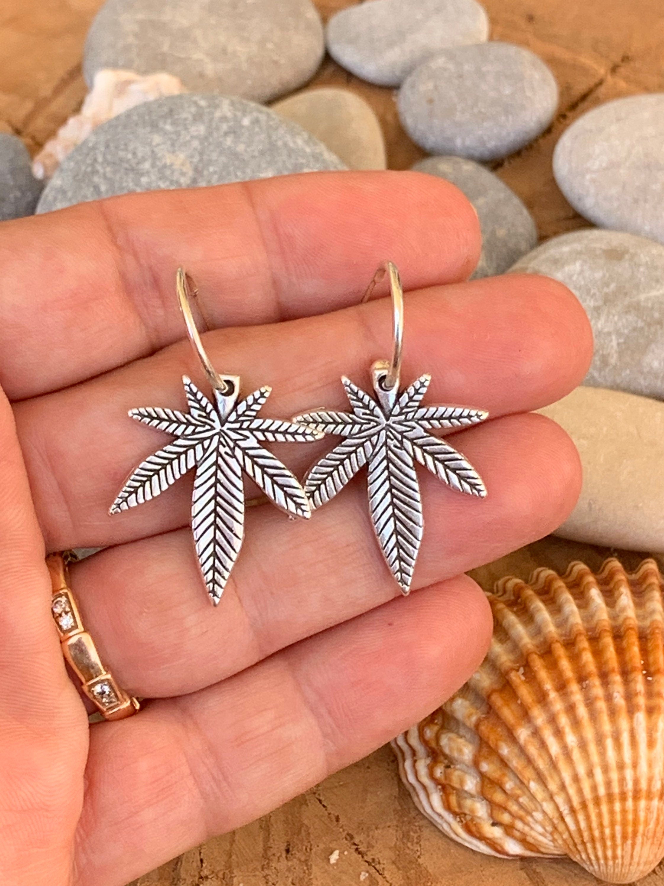 Bohemian silver earrings with dangle marijuana leaf