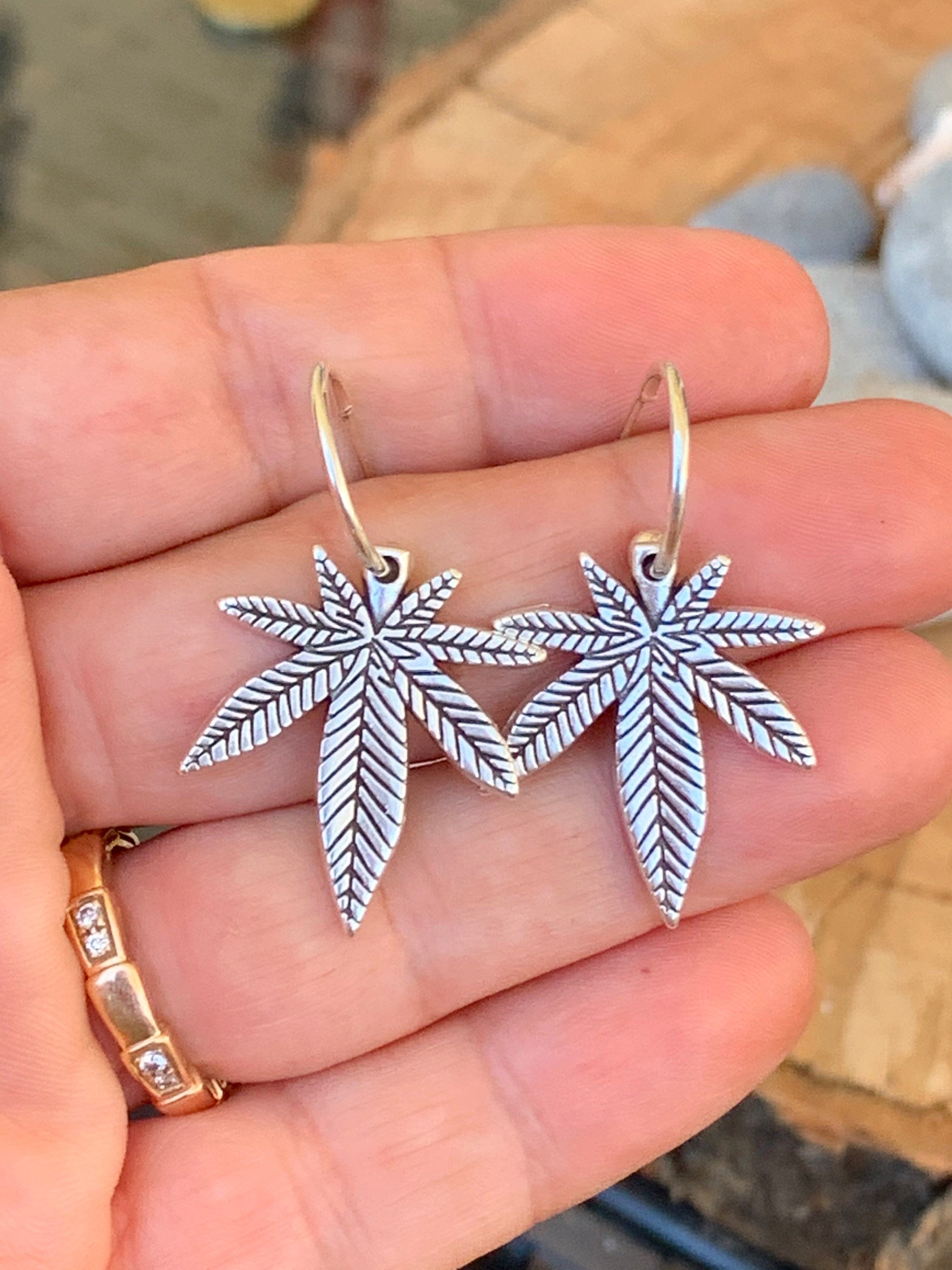Bohemian silver earrings with dangle marijuana leaf
