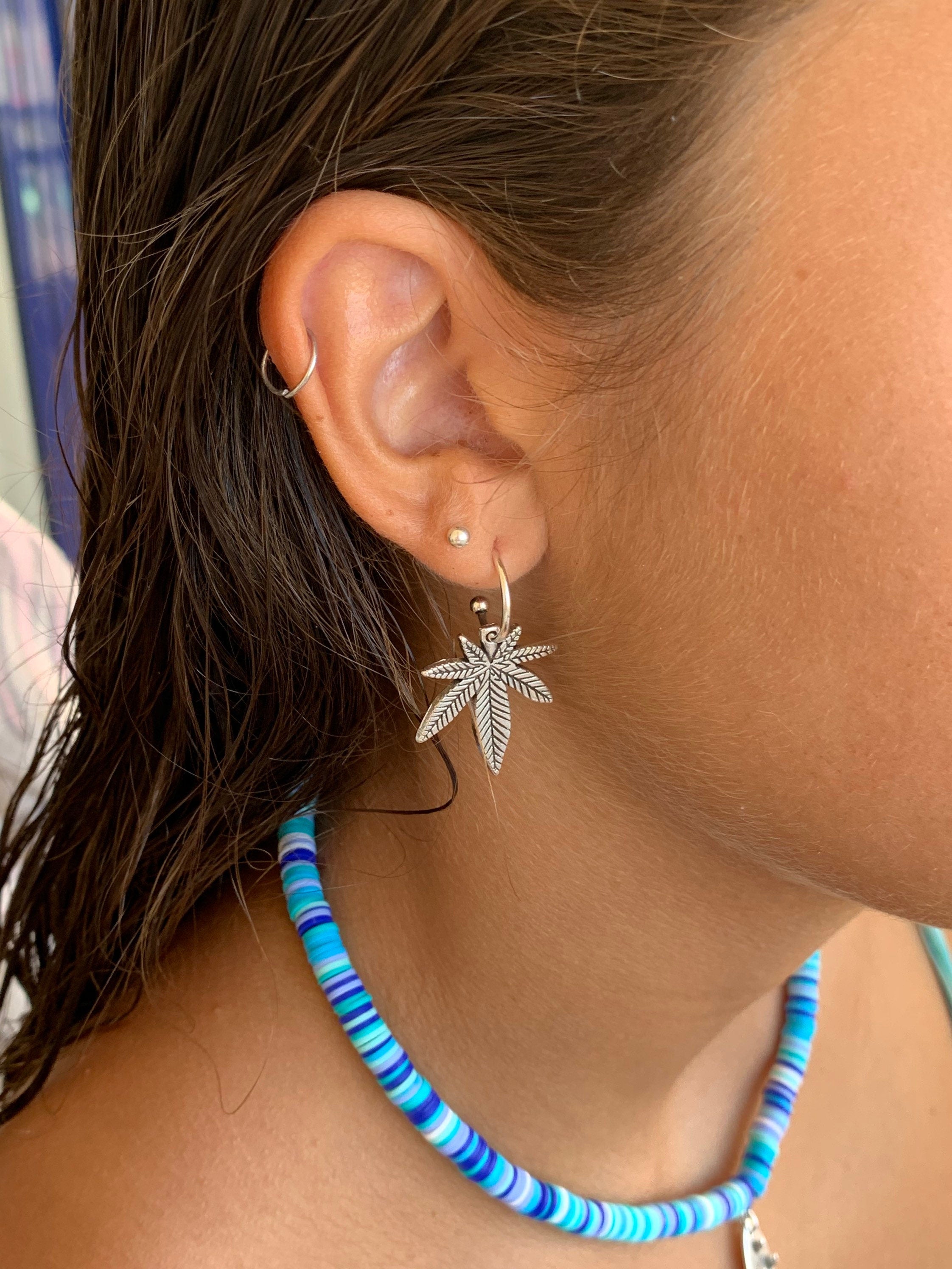 Bohemian silver earrings with dangle marijuana leaf