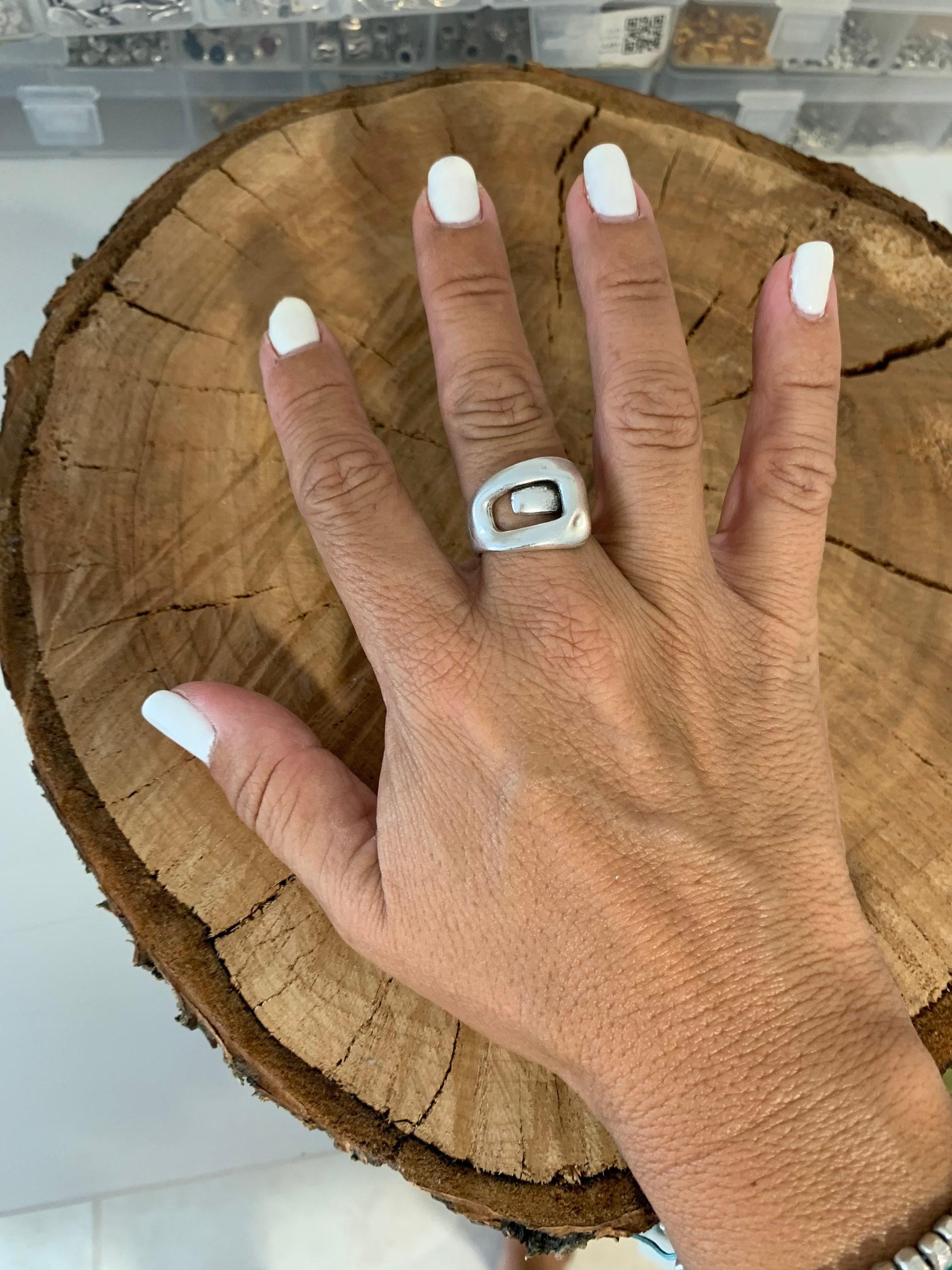 Bold, chunky, silver adjustable ring—perfect for birthdays. statement jewelry, a stylish silver gift for a friend or mom. on trend