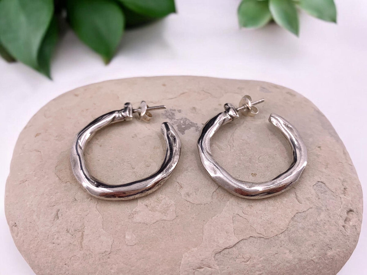 Hammered chunky silver hoop earrings with engraved texture, bold design, large size