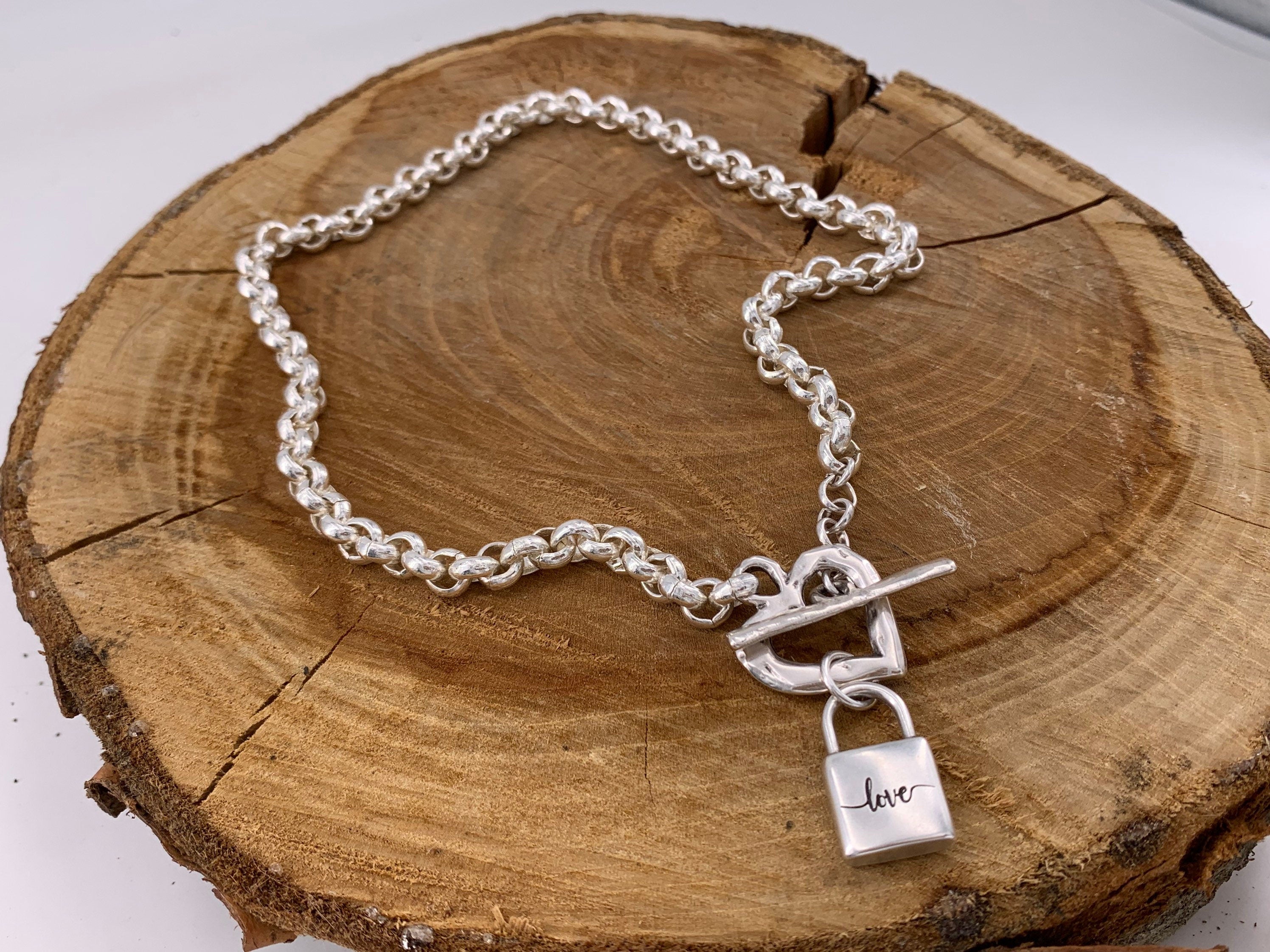 Thick chain silver necklace with a heart-shaped toggle clasp and a padlock-shaped pendant, uno de 50 style silver chunky necklace,