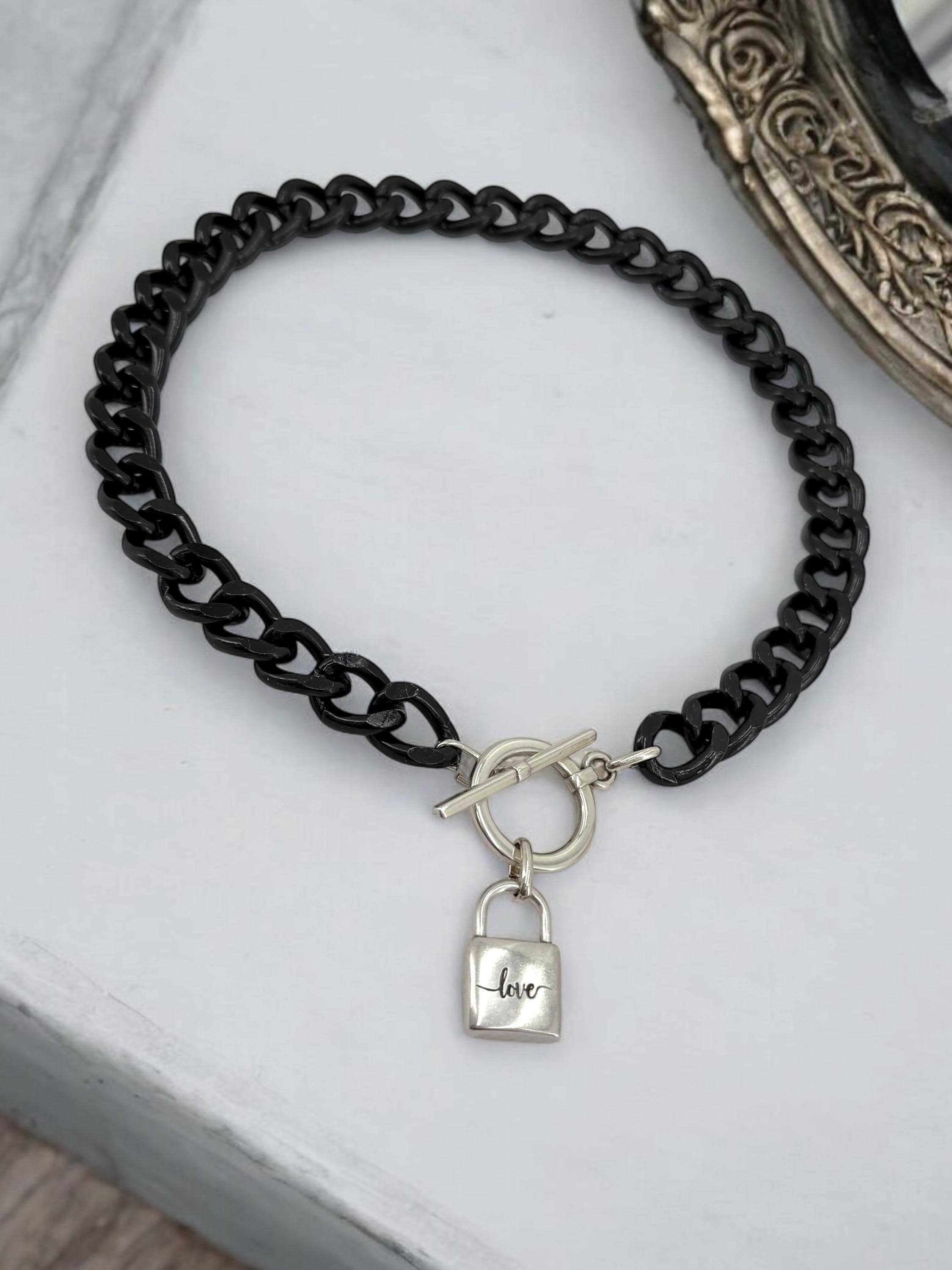 Chunky aluminum black chain necklace with silver toggle clasp and “love” padlock pendant
