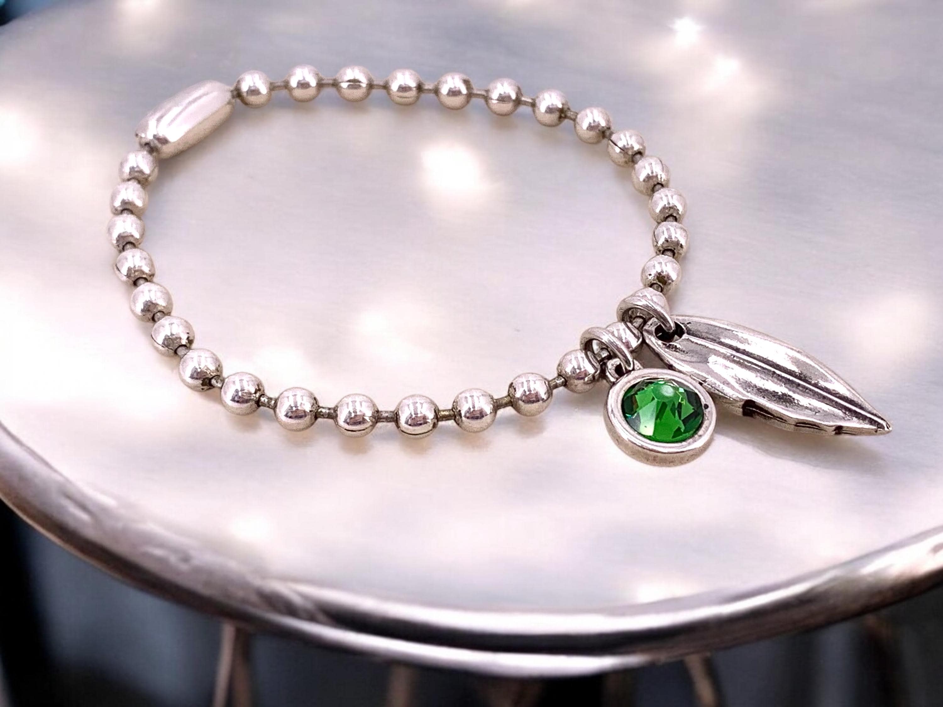 Silver balls chain bracelet with a leaf and Swarovski crystal charm