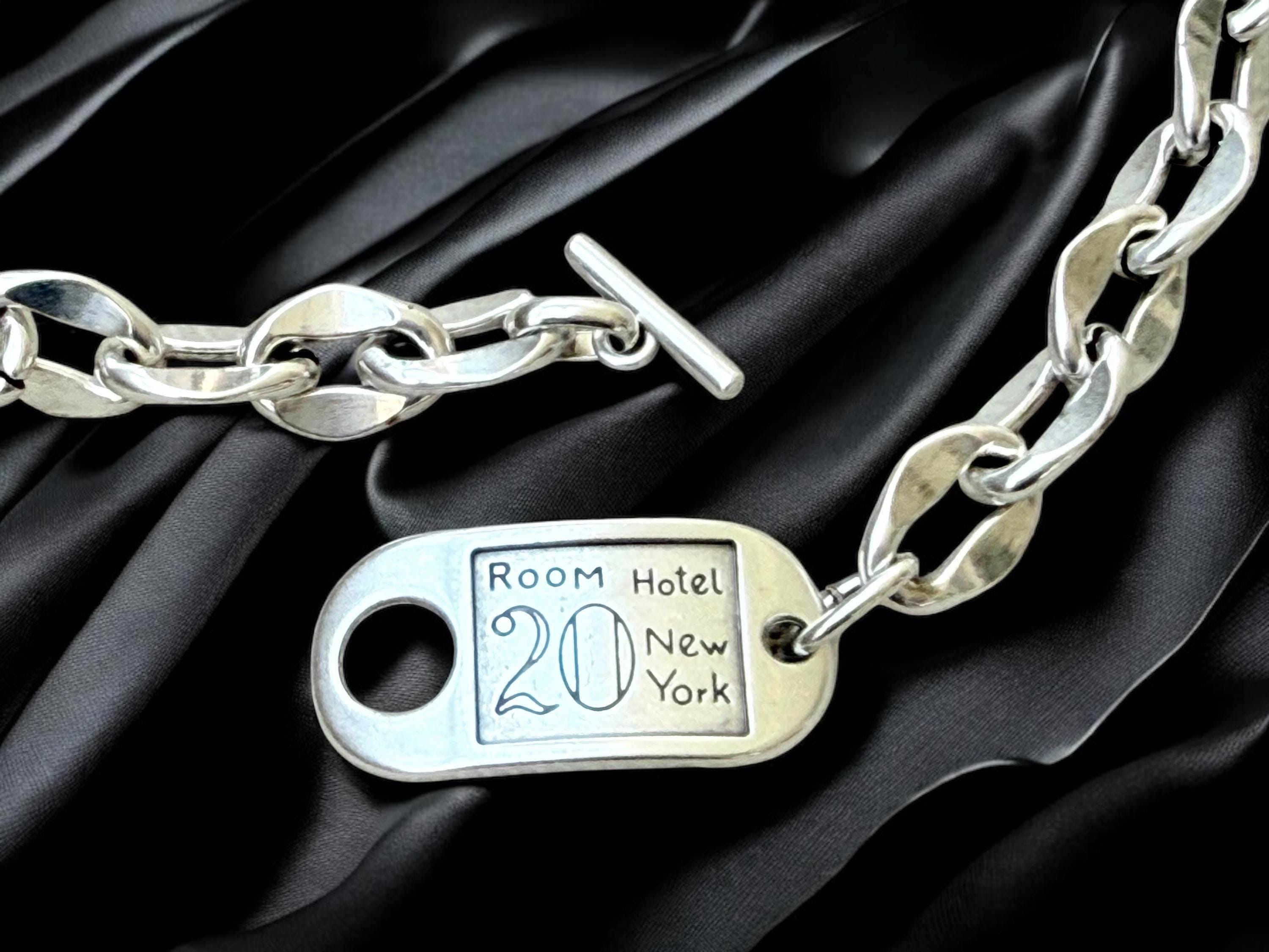 Chunky silver chain necklace with sculpted toggle clasp. Handmade in silver-plated steel. Industrial jewelry