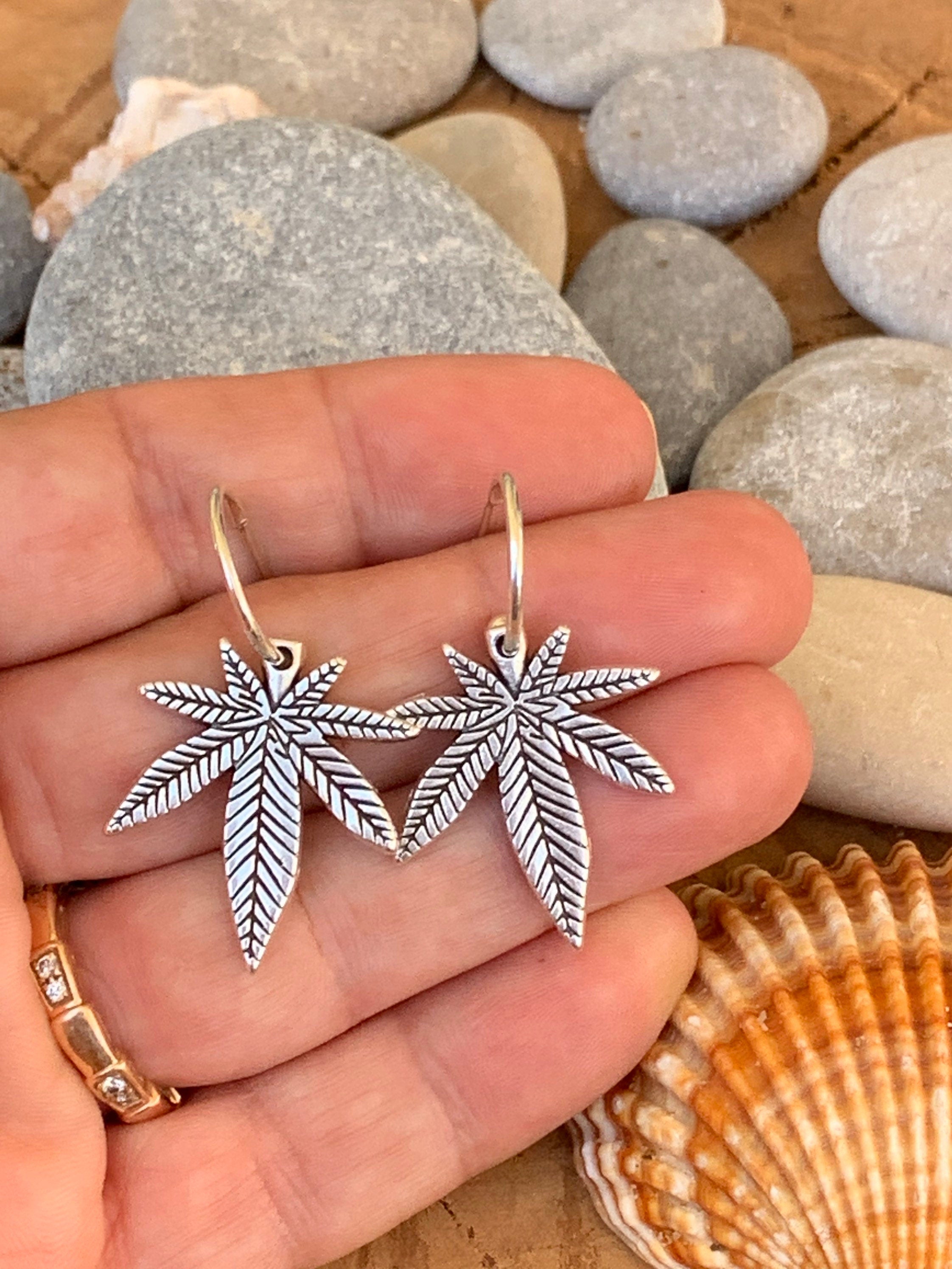 Bohemian silver earrings with dangle marijuana leaf