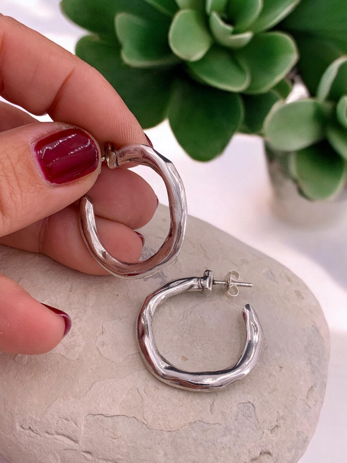 Hammered chunky silver hoop earrings with engraved texture, bold design, large size