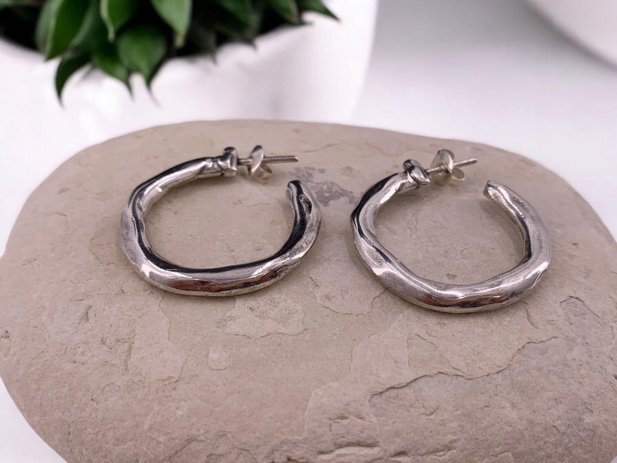 Hammered chunky silver hoop earrings with engraved texture, bold design, large size