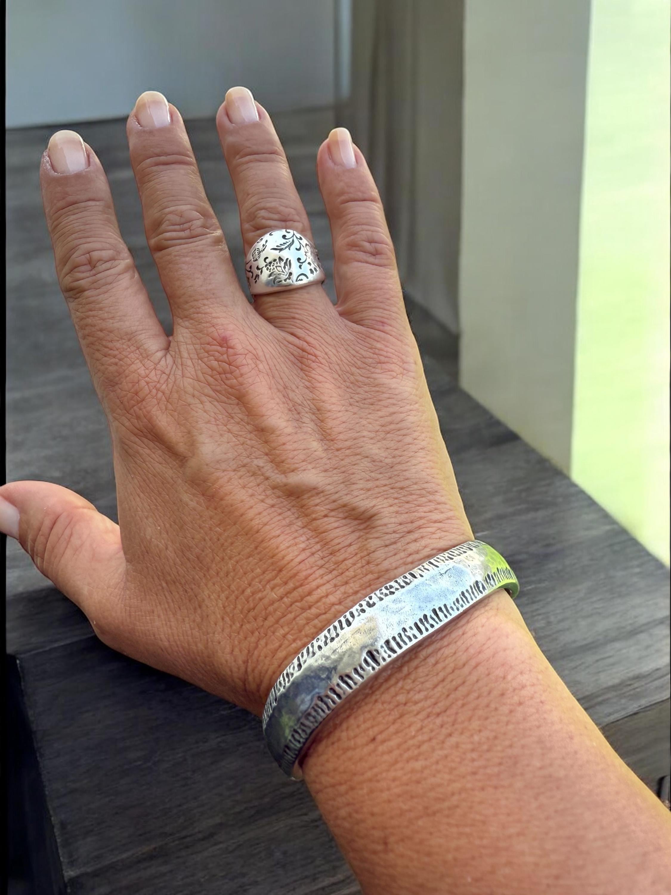 Chunky silver dome ring with engraved floral motifs